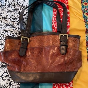 Tignanello Brown Leather Bag 12 Inches Long
8 Inches High 5 Inches Wide.